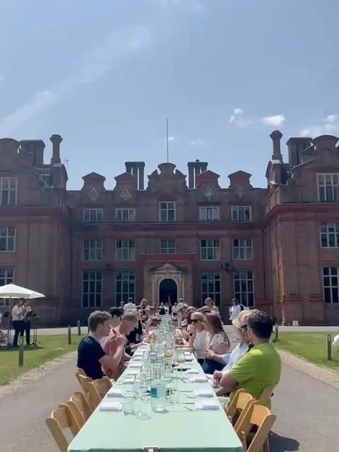 Guests enjoying an outdoor wedding reception