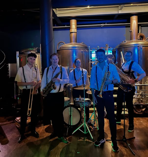 Rio Brass musicians performing together at a brewery